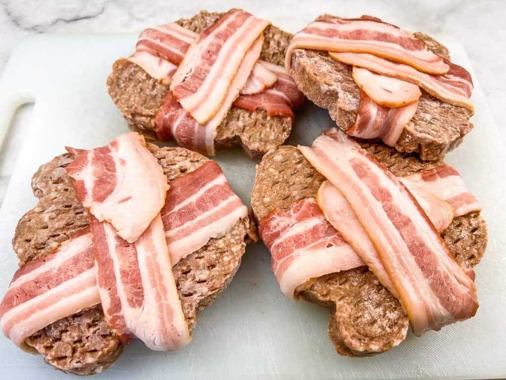 Wrap the burgers in bacon.
