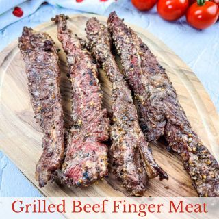 Grilled Beef Finger Meat on a cutting board.