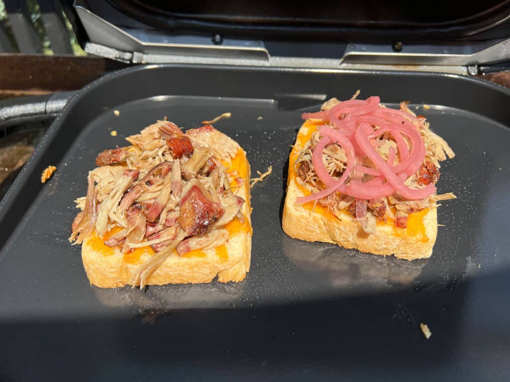 Spoon the pulled pork over the cheese, keeping it centered so it doesn’t spill out.