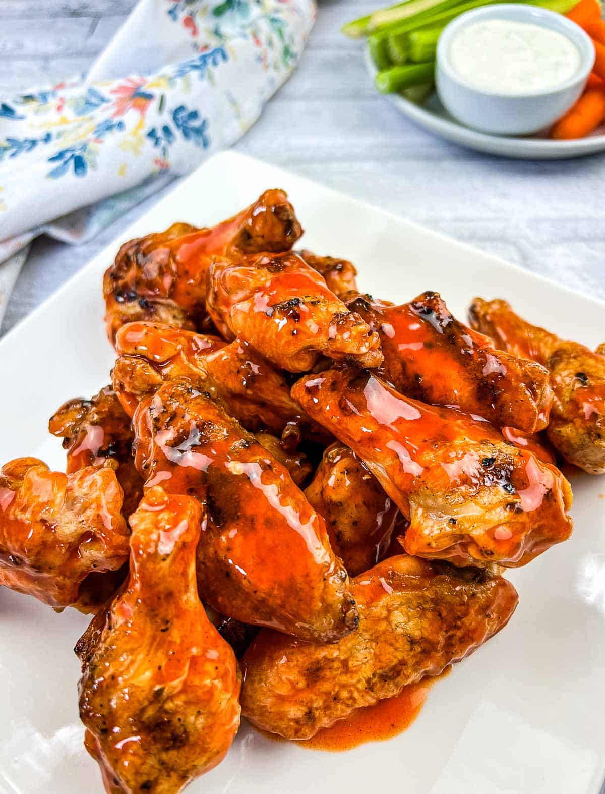 Grilled Wings with Buffalo Sauce on a plate.