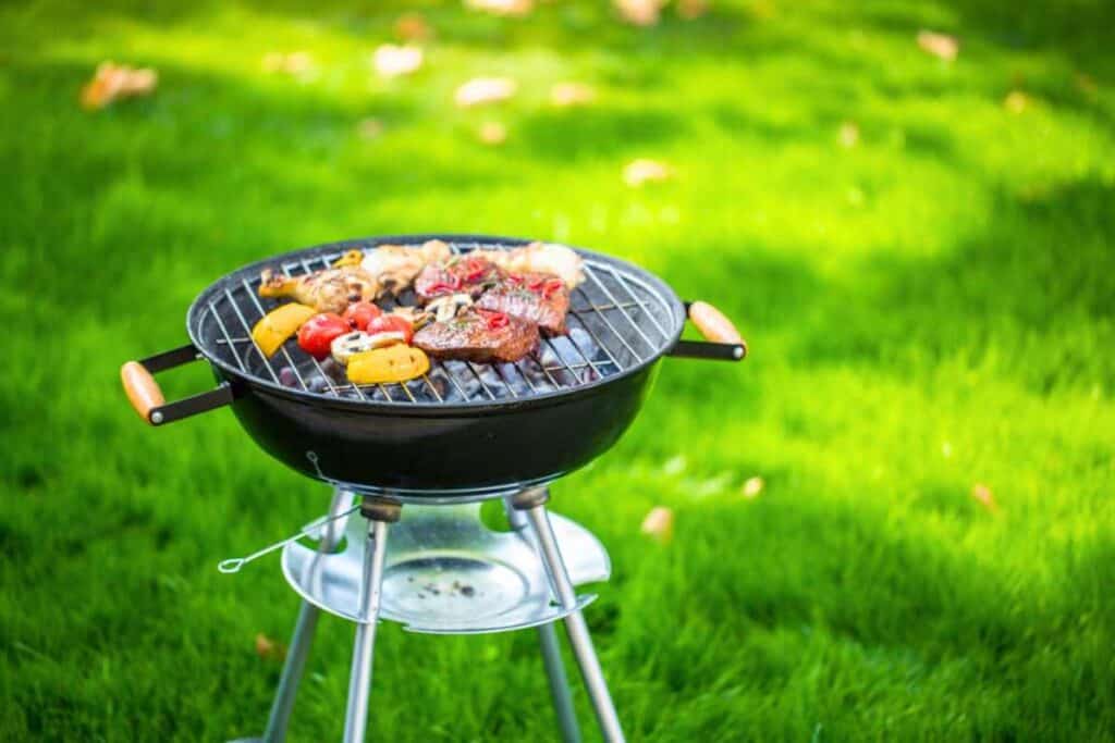 Grilling foods using charcoal grill.