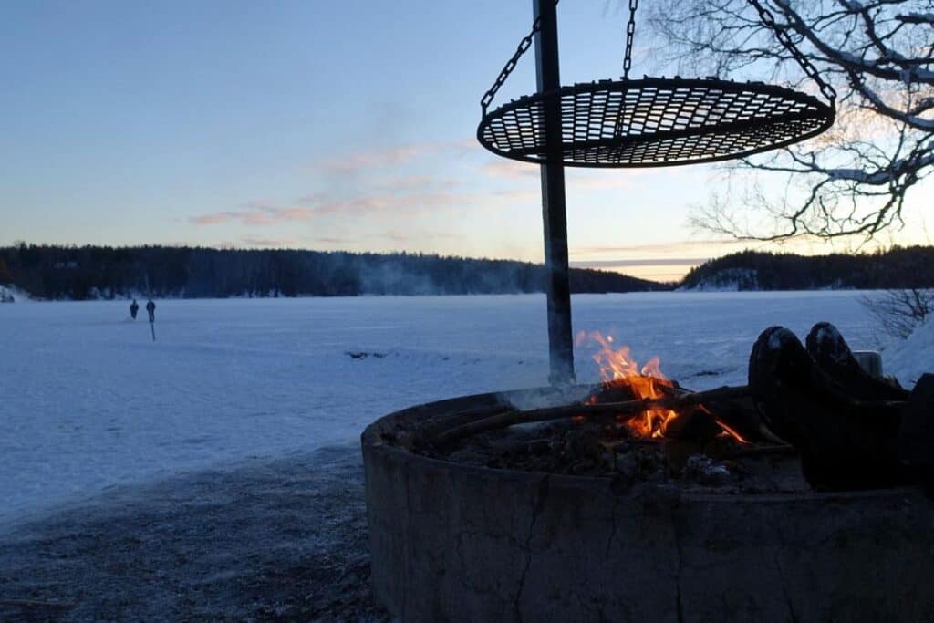 Grill almost ready for a barbecue at sunset.