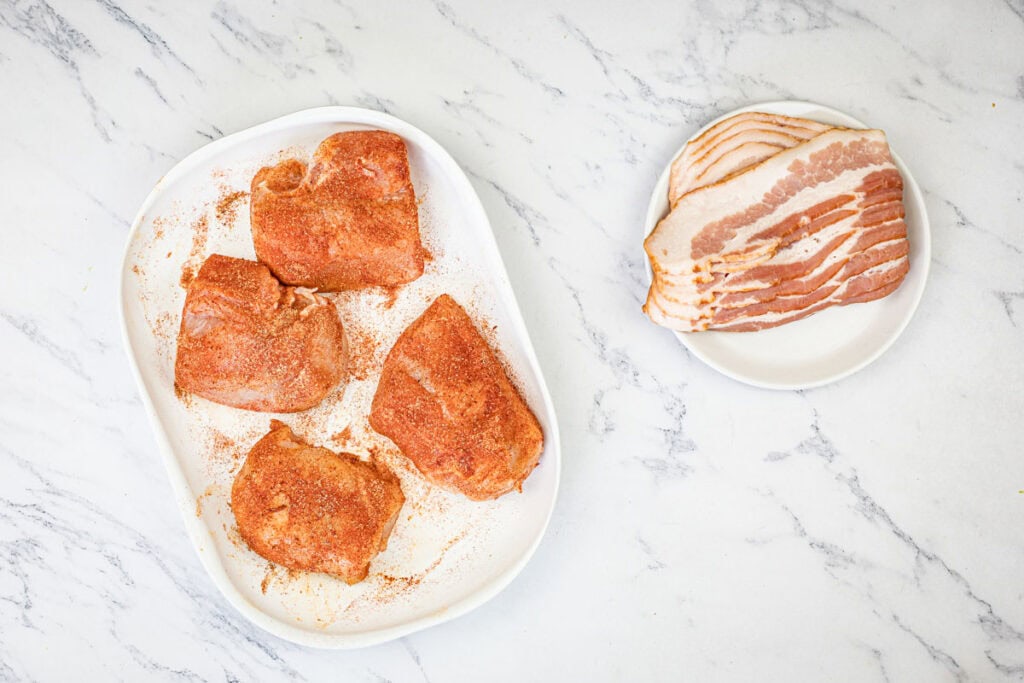 Wrap each chicken breast with two slices of bacon.