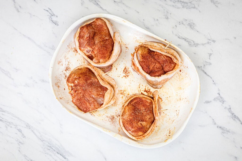 Season chicken breasts with garlic salt, onion powder, and paprika for an even coating.