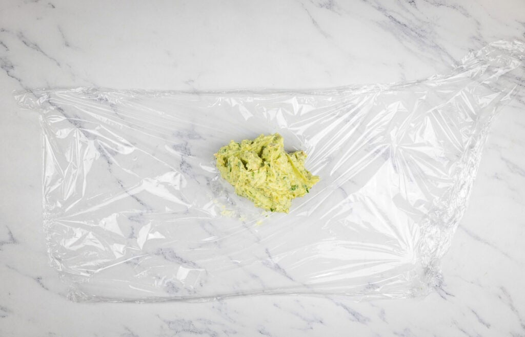 Mixed butter in a sheet of plastic wrap.