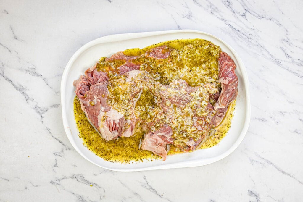 Smear the marinade over the skirt steak.