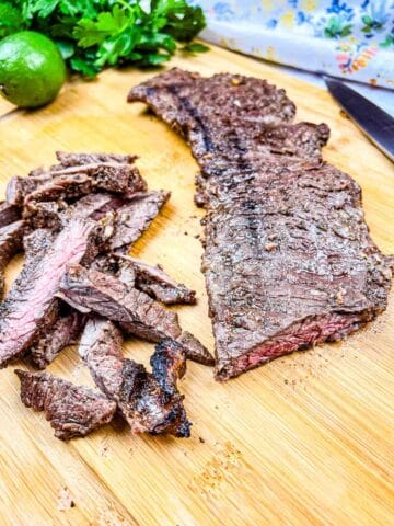 Carne Asada with slices on a board.