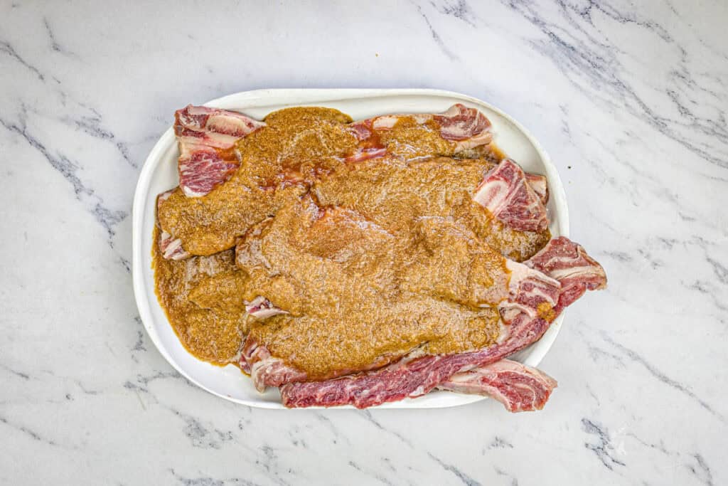 Pour the marinade over the ribs.