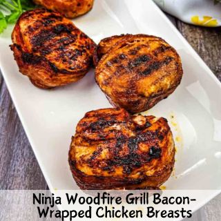 Ninja Woodfire Grill Bacon-Wrapped Chicken Breasts on a plate.