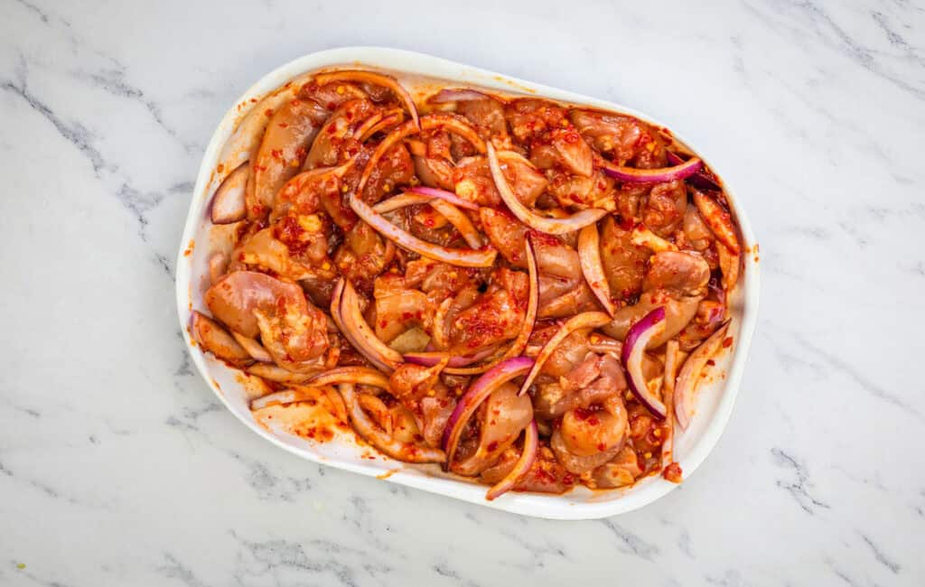 Marinate the chicken.