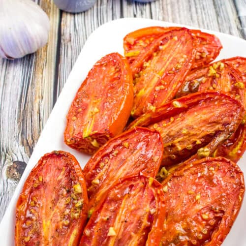 Close up shot of Smoked Tomatoes on a white plate.