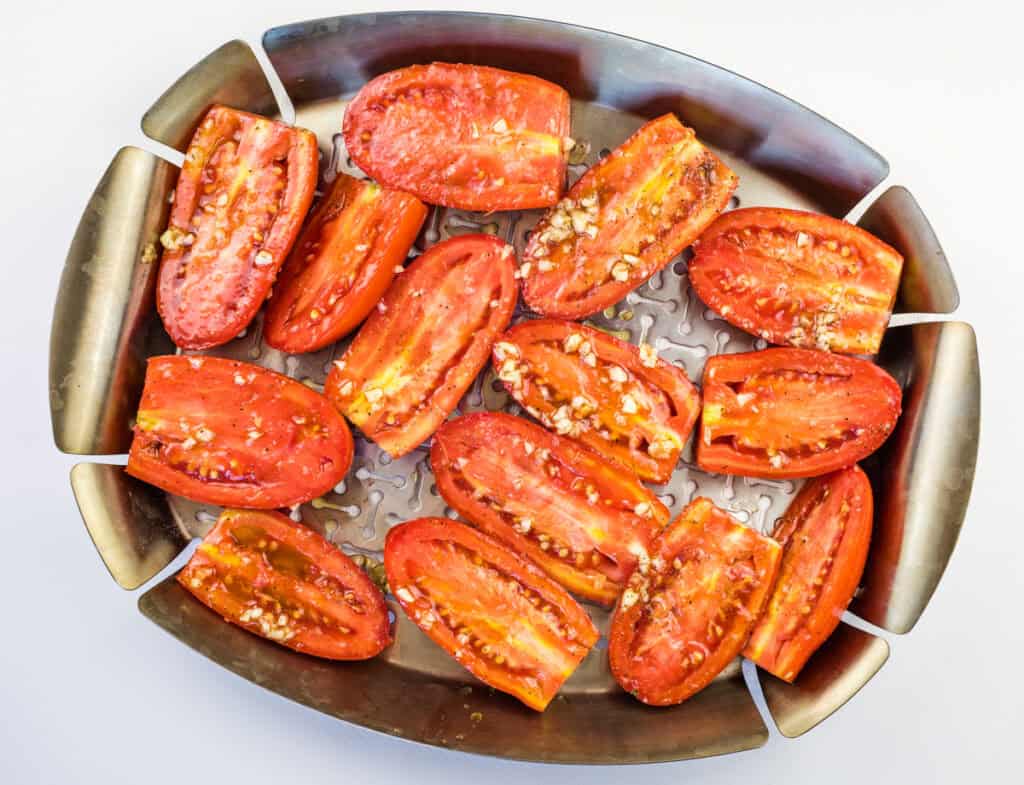 Place the tomatoes on a grill pan or basket and smoke them.