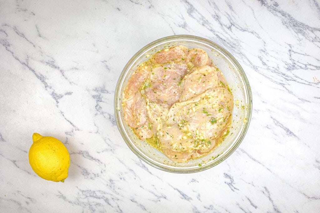 Pour the marinade over the chicken, ensuring all pieces are well coated.