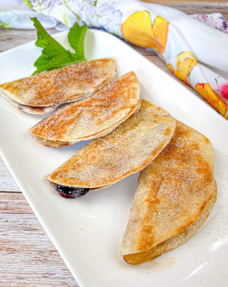 Four pieces of Fruit Quesadillas on a plate.