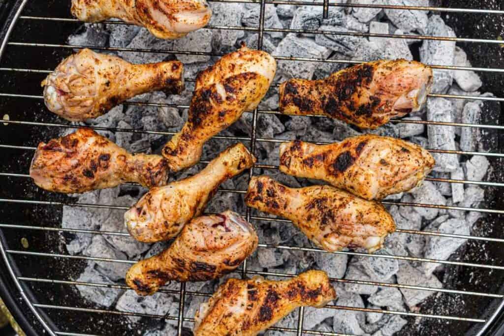 Move the drumsticks to the hot side of the grill and cook.