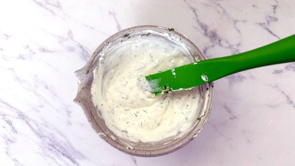 Stir together the Greek yogurt, mayo, chopped cilantro, fresh lime juice, and garlic in a small bowl.