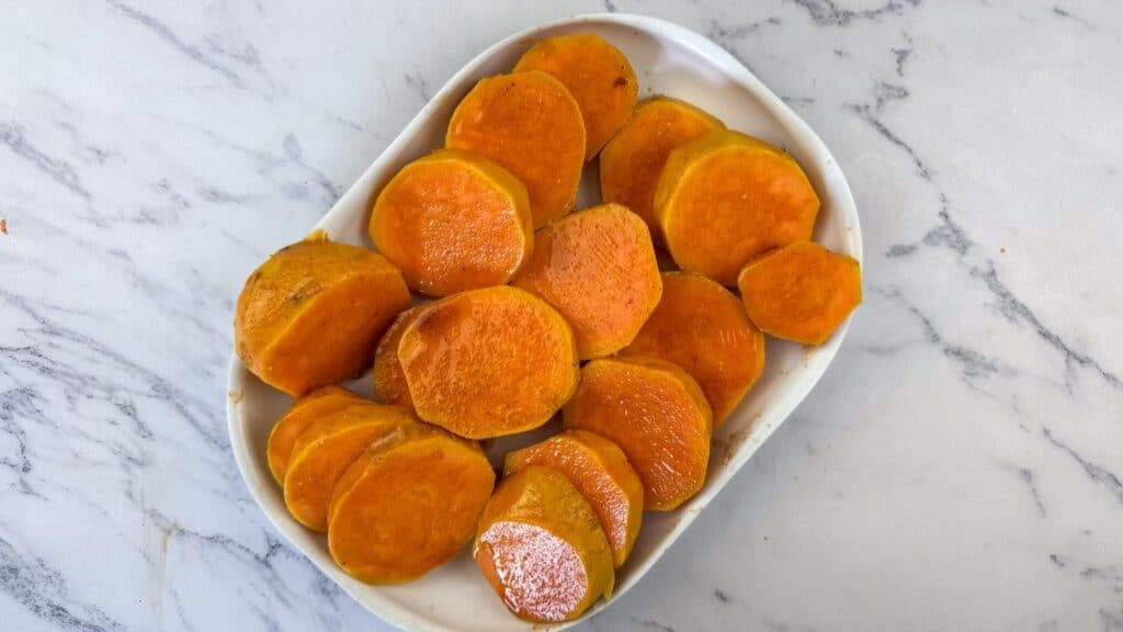 Boil the sweet potatoes until they are just tender enough to pierce with a knife, then drain.