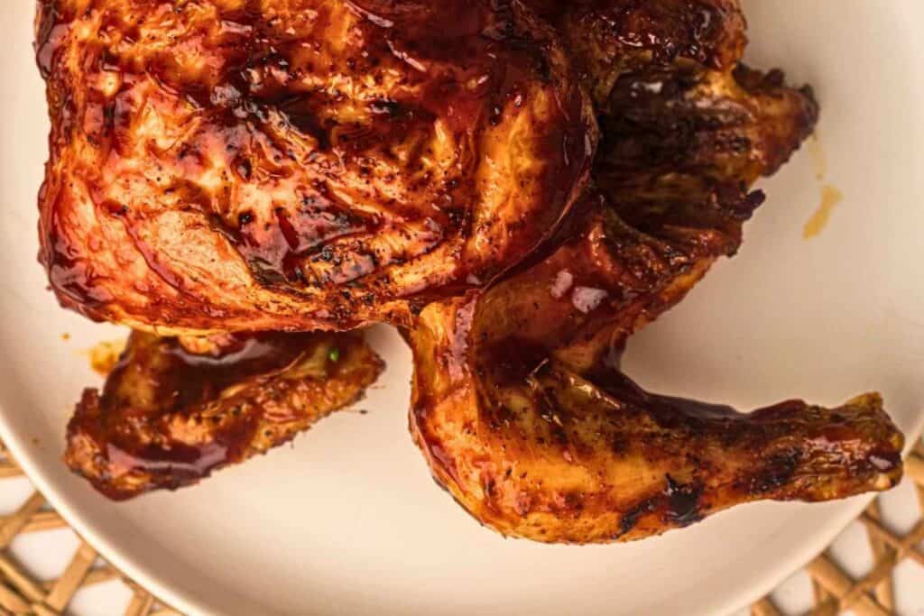 Grilled Whole Chicken on a round plate.